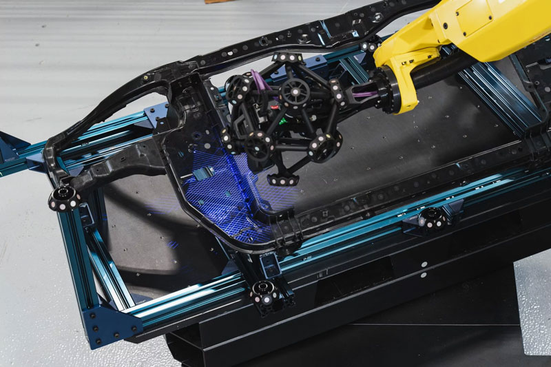 Above view of a MetraSCAN-R BLACK HD insecting a black car frame