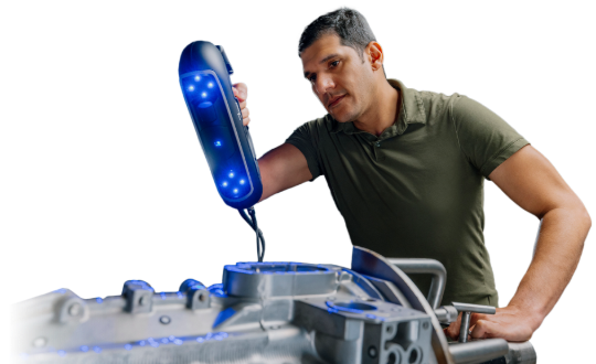 Technician using a PRO Series 3D scanner to capture details of a metal casting part