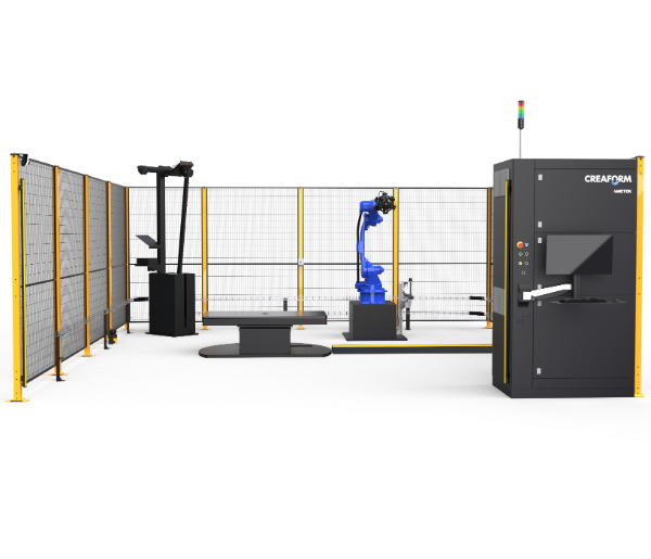 The M4 measuring cell with blue robot, table, calibration arm and Creaform control unit inside the safety enclosure