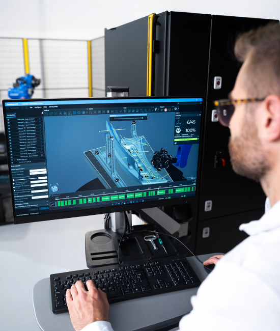 Computer screen displaying Automation software with a robotic scanner analyzing a metallic part