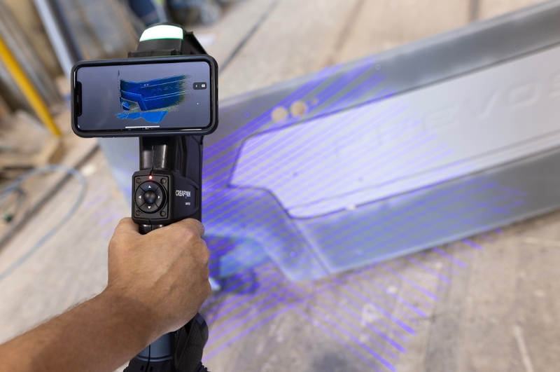 HandySCAN 3D MAX with phone clip scanning a bumper