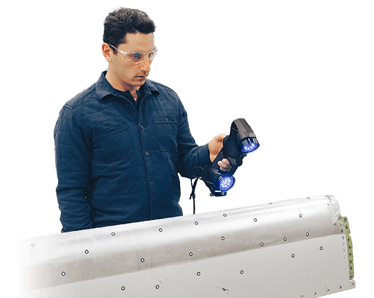 Engineer scanning aerospace leading edge with handyscan black