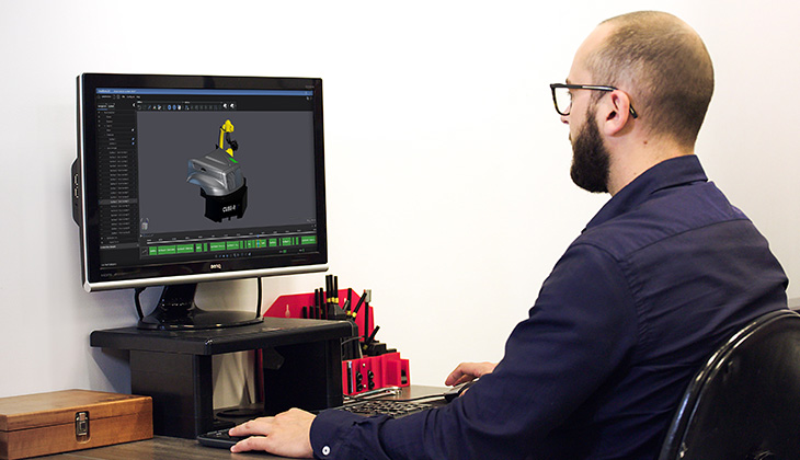 An engineer analyzing the Automation - Plan software interface displayed on their computer screen